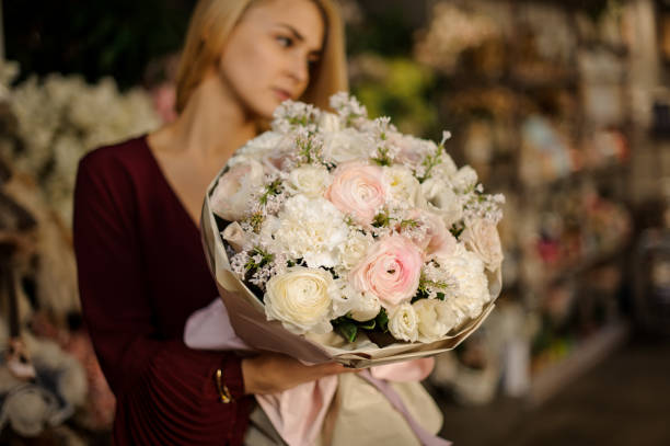 istock Holiday bouquet in beautiful woman's tender hands 1210294053