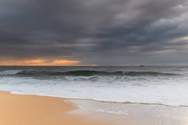 istock Sunrise Seascape and Rain Clouds 1210295341