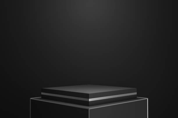 istock Modern podium or pedestal display on dark background with spotlight showing concept. Blank standing  product shelf or backdrop. 3D rendering. 1210297866