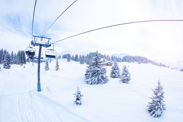 istock Ski lift over magnificent snow covered fir forest 1210298914