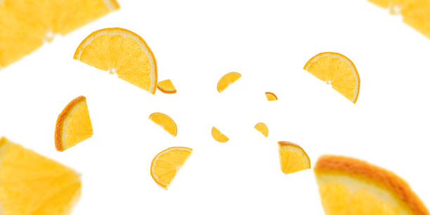 Background orange lemon slices. Citrus fruit tangerine falling on white. Selective focus.