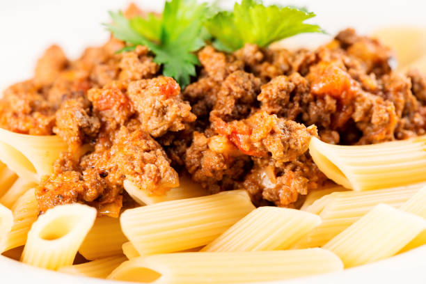 istock Penne Pasta with Bolognese Sauce macro 1210303260