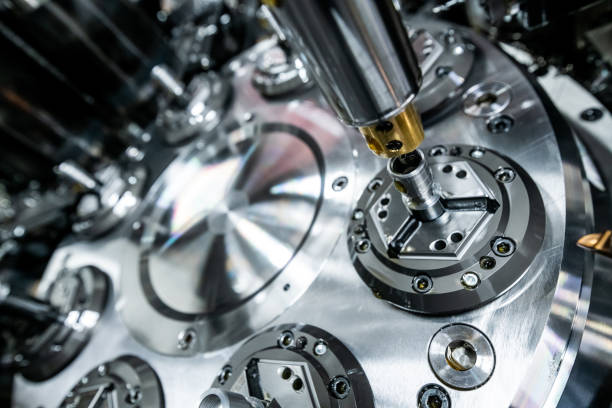 istock Mechanical industry machinery: inside of a modern multi-spindle CNC lathe machine 1210304088
