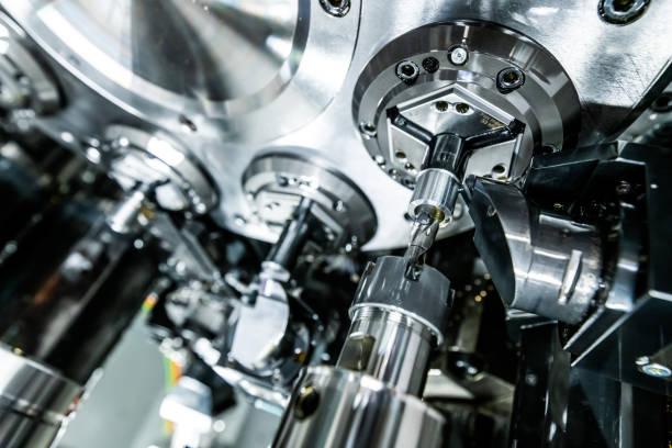 istock Mechanical industry machinery: inside of a modern multi-spindle CNC lathe machine 1210304827
