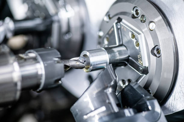 istock Mechanical industry machinery: inside of a modern multi-spindle CNC lathe machine 1210304939