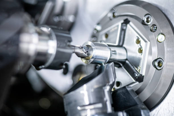 istock Mechanical industry machinery: inside of a modern multi-spindle CNC lathe machine 1210305071