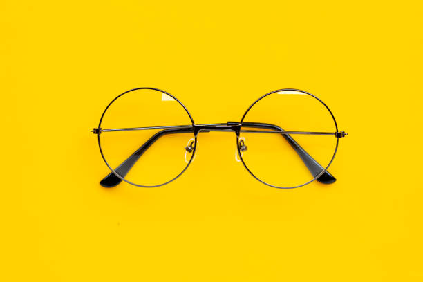 istock Eye Glasses on yellow background. 1210306503