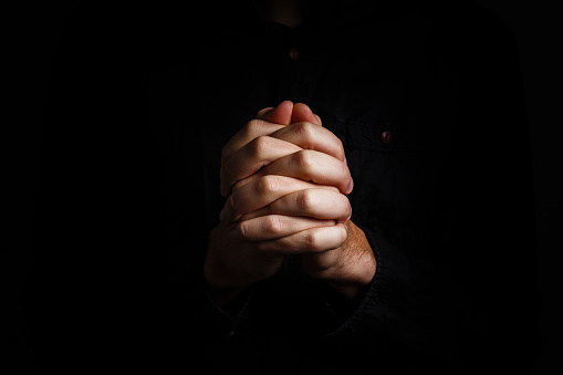 Praying Hands on a black background