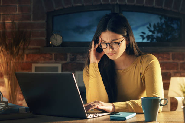 istock Tired woman at home with headache 1210308533