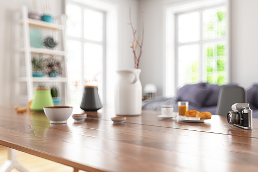 Wooden Table Top with Blur of Modern Living Room Interior