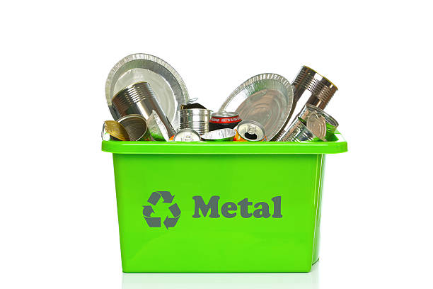 Photo of a green metal recycling bin isolated on a white background.