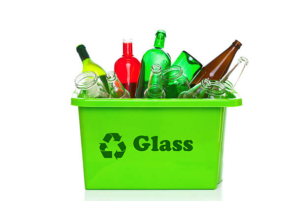 Glass waste for recycling in a recycling facility. Different glass packaging bottle waste. Glass waste management. Process of waste glass into usable products. Pile of  different bottles.
