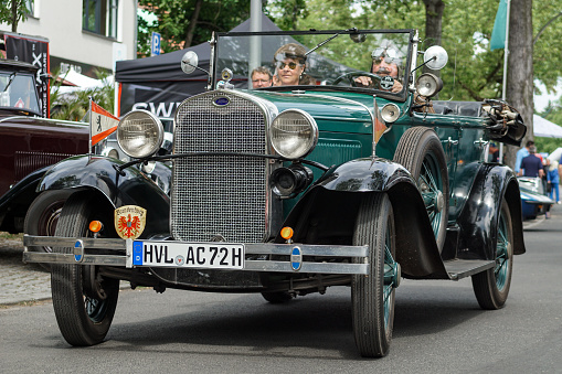 Welfenallee, Berlin, Germany - june 16, 2018: a green Ford cabrio at the annual Oldtimer car meeting in Frohnau