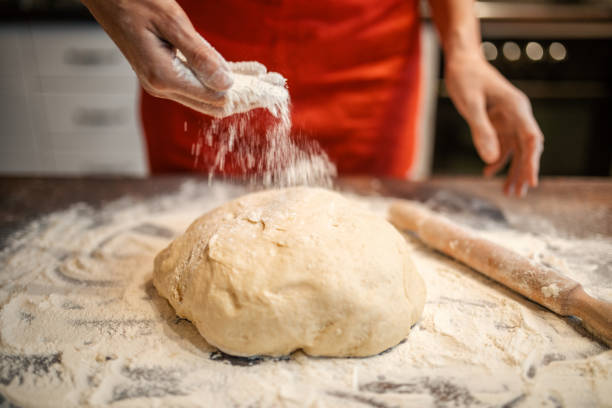 istock Woman preparing dough for bread 1210310259