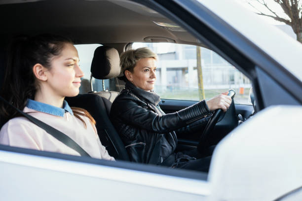 istock Mother and daughter together in car 1210310339