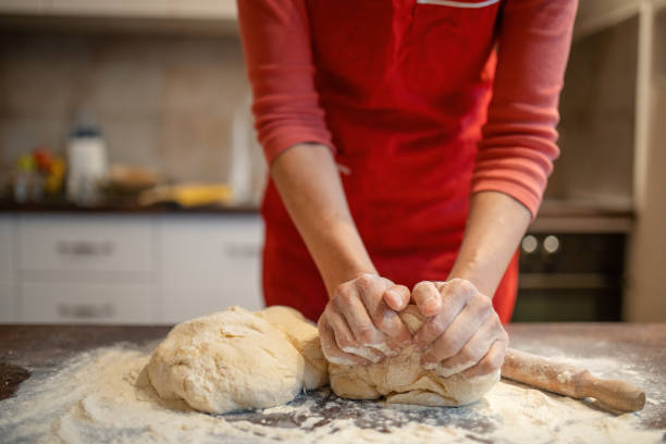 Woman preparing dough for bread