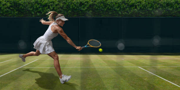 tenisistka w połowie ruchu podczas gry na trawie - action tennis women tennis racket zdjęcia i obrazy z banku zdjęć