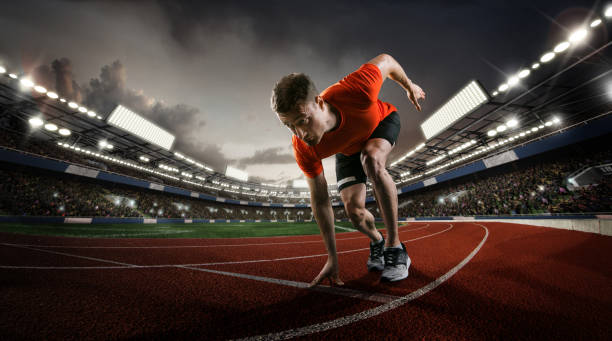 istock Sport backgrounds. Sprinter starting on the sport arena. Dramatic image. 1210320989