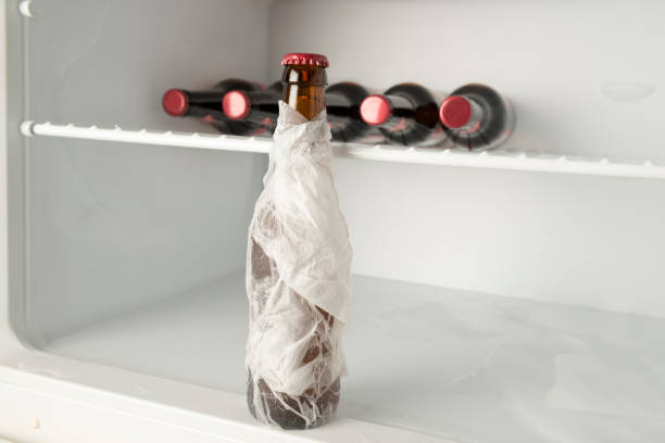 Life Hacks Chill Beer Quickly in the Freezer Lifehacks - Chill a beverage quickly in the freezer with wet paper towels. lifehack stock pictures, royalty-free photos & images