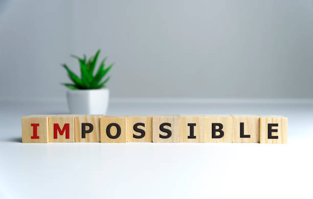 istock wooden cube with word impossible to possible, Personal development and career growth or change yourself concept. 1210324203