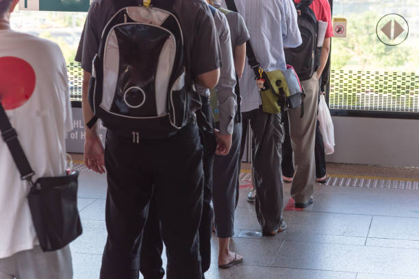 istock Crowded Asian commuters queuing at train station in Singapore 1210326238