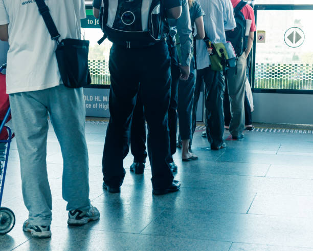 istock Crowded Asian commuters queuing at train station in Singapore 1210326282