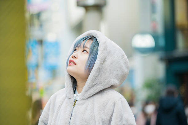 istock young woman with blue hair 1210326286