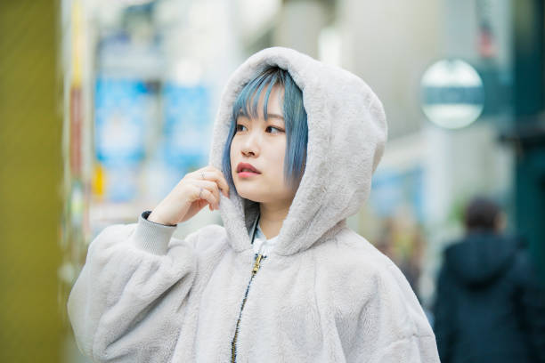 istock young woman with blue hair 1210326333