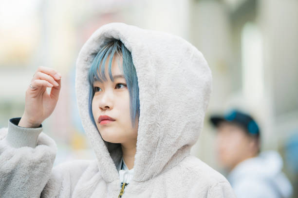 istock young woman with blue hair 1210326423