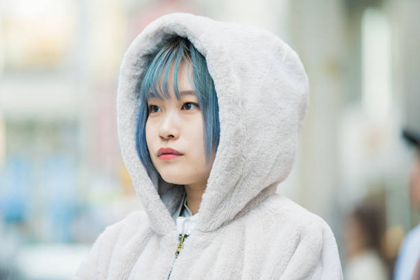 istock young woman with blue hair 1210326438