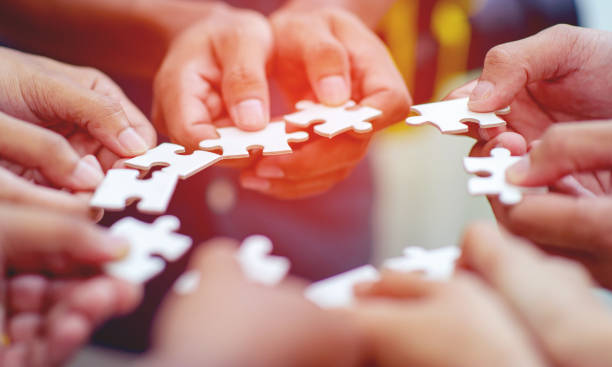 istock Team work, hands and jig Saw Unite with power Is a good team of successful people Team work concept 1210328295