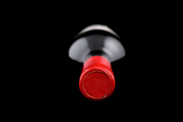 Bottle of wine lying down on a dark background