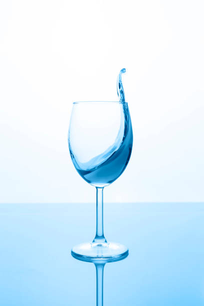 istock glass of red wine with wave on light background, classic blue concept whith copy space. 1210330531