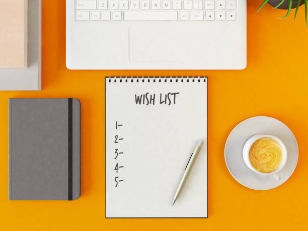 istock Wish List with Laptop and Coffee 1210332624