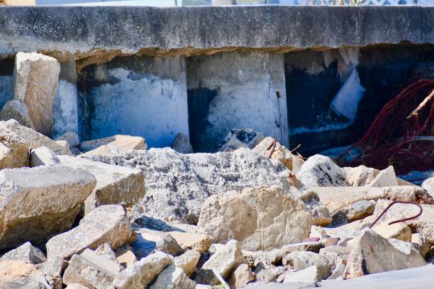 istock Exposed Concrete Foundation after a Storm on the Ocean 1210332699