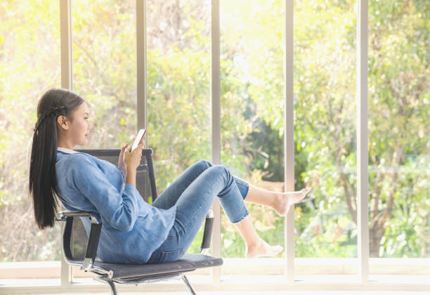istock Working from home concept young asian influencer people working and using smart phone social media  Business team to record and live internet vlogging wearing casual suit outfit happy action in modern Coworking space 1210333318