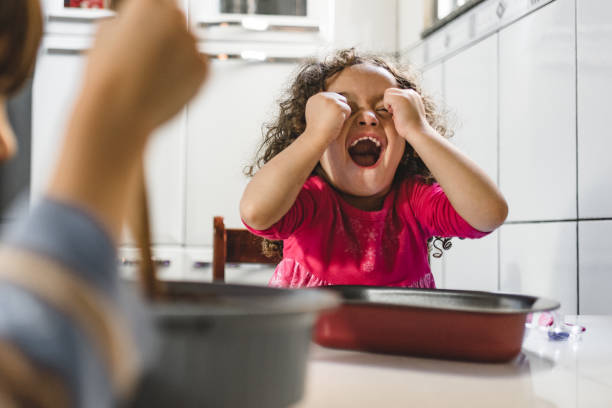 istock Playful little girl in the kitchen 1210334693