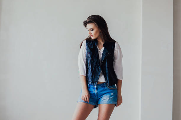 istock girl model posing in the Studio beautiful 1210335048