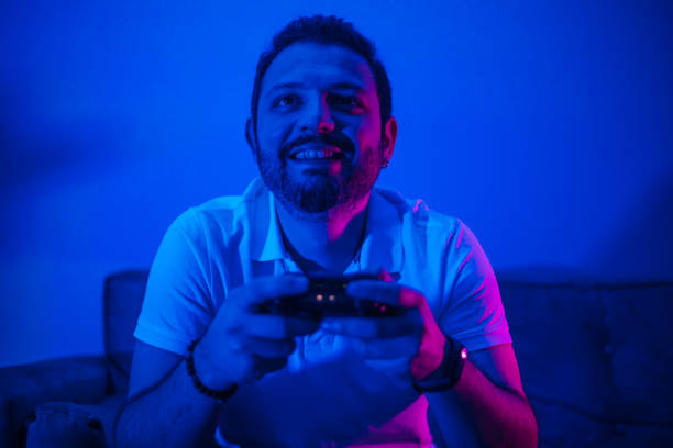 istock Happy man celebrating victory in video game 1210337219