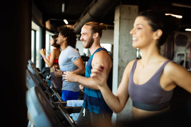 istock Healthy young athletes friends doing exercises at gym. 1210337234