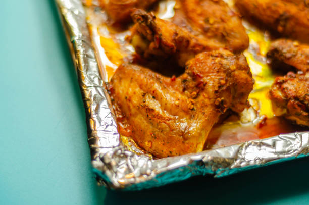 Roasted chicken wings marinated in a spicy peri-peri sauce, a delicious snack