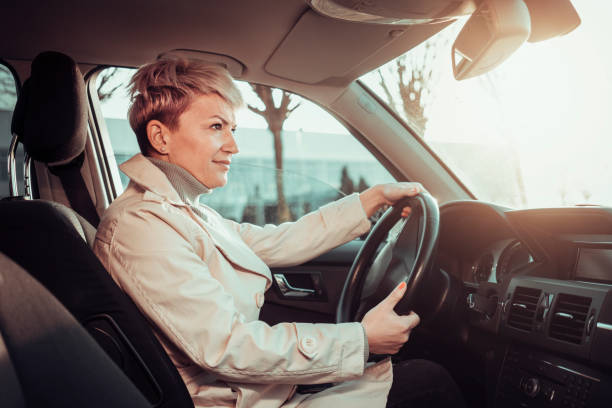 istock Smiling woman in a car 1210340035