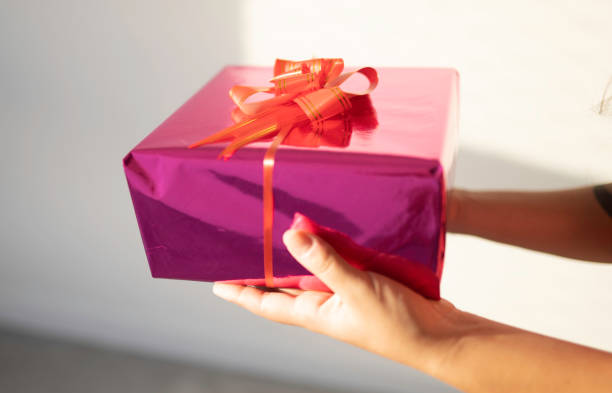 istock woman with a gift stock 1210340154