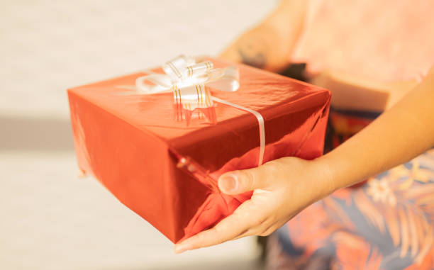 istock woman with a gift stock 1210340240