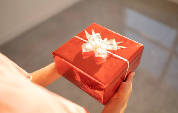 istock woman with a gift stock 1210340298