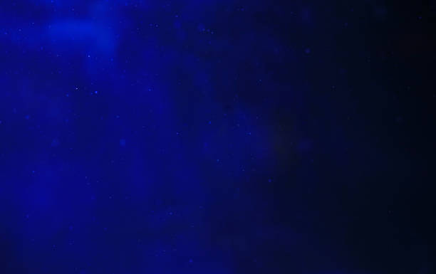 istock Abstract background light glow and particles of underwater similar the universe. 1210340565