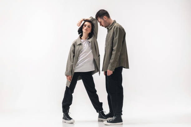 istock Trendy fashionable couple isolated on white studio background 1210342950