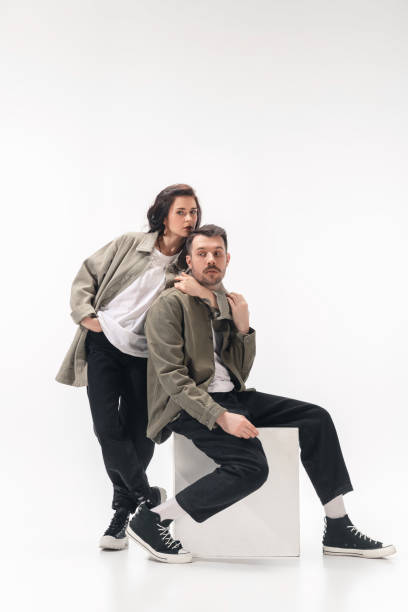 istock Trendy fashionable couple isolated on white studio background 1210343082