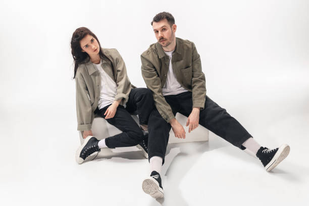 istock Trendy fashionable couple isolated on white studio background 1210343108
