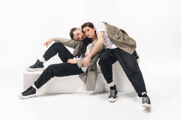 istock Trendy fashionable couple isolated on white studio background 1210343135